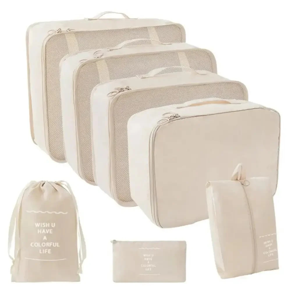 Beige travel organizer storage set with suitcase packing cubes and folding cases
