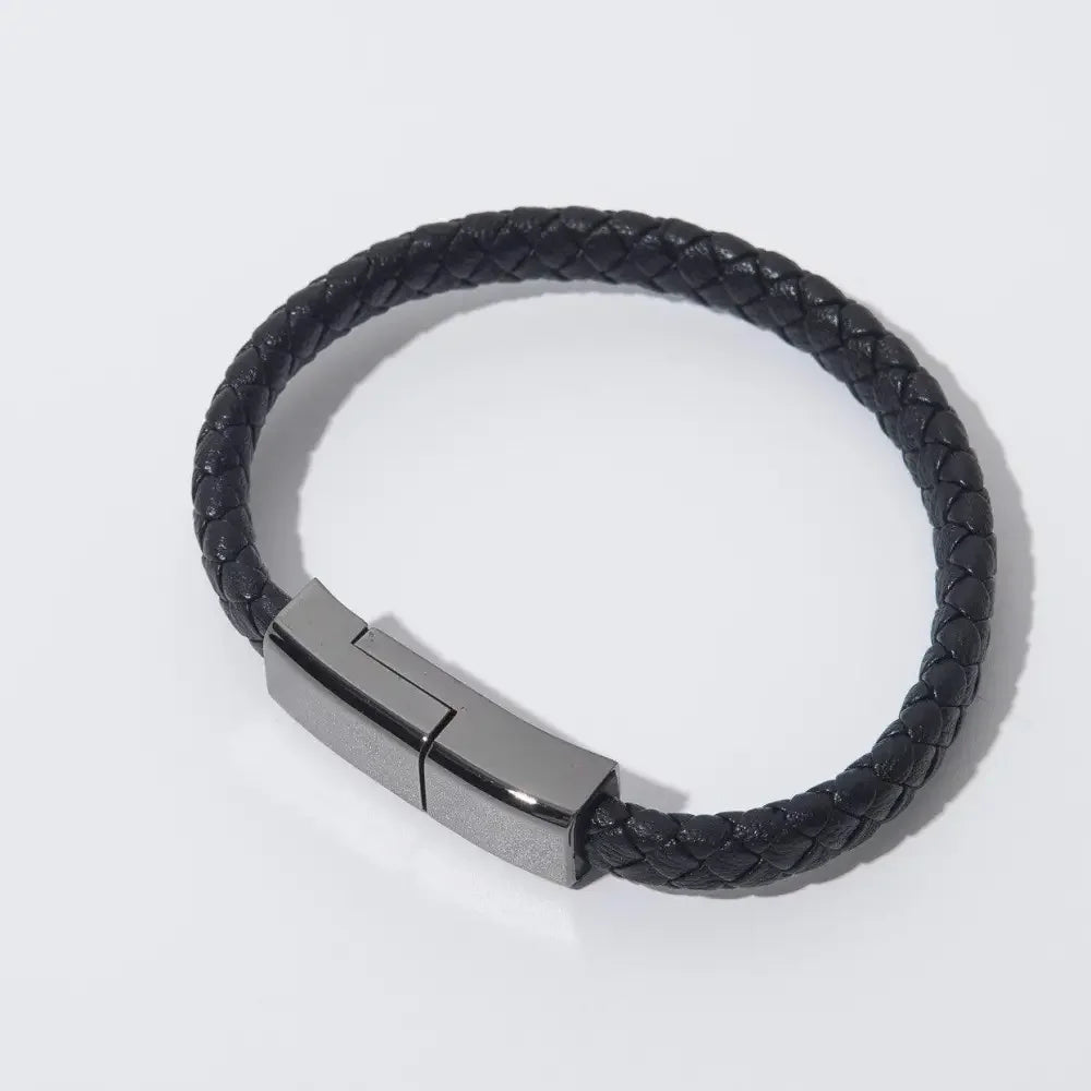 Braided black leather bracelet with metal clasp and built-in USB charger for phones
